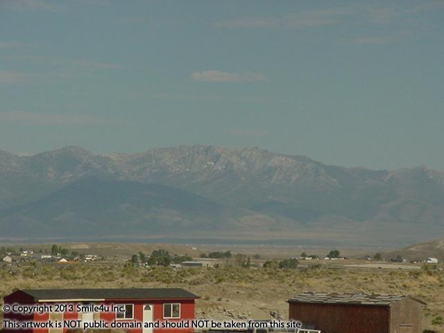 Fabulous views of the Ruby Mountains with Ruby Dome, the highest peak at 11,317 feet. The neighbors have a cute red house and barn set up a few lots away from this land for sale in Elko County, Nevada! 